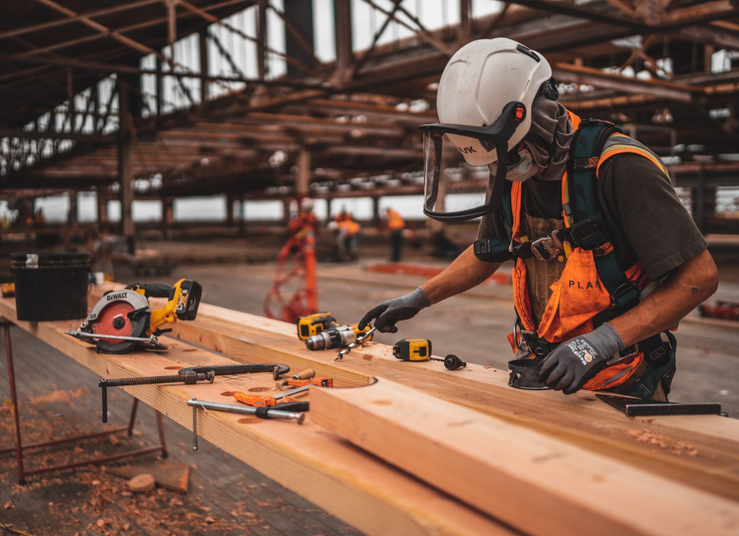 Construction worker in hi vis at workstation